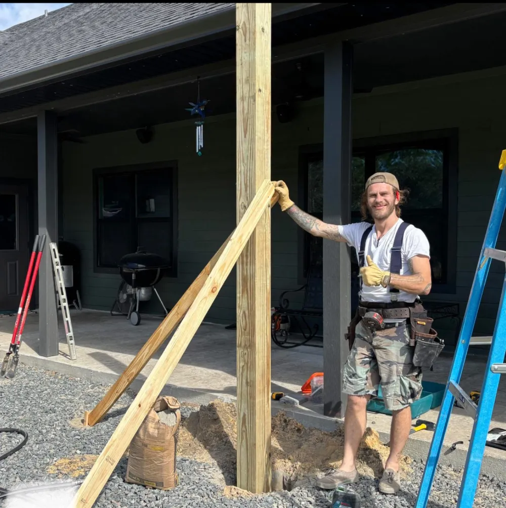 Enigmatic Solutions crew setting a porch post